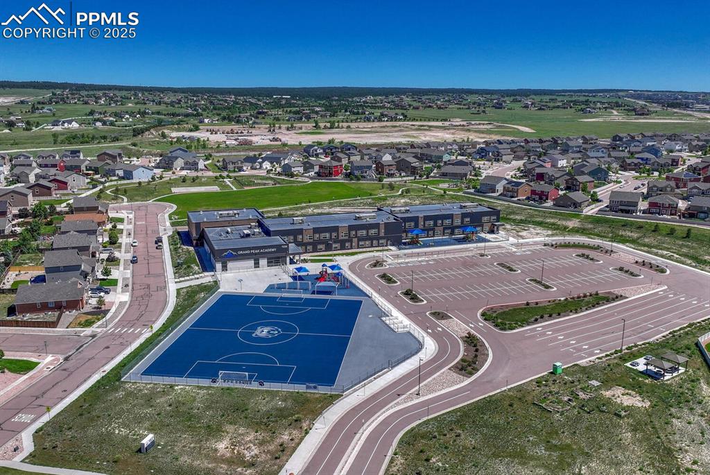 8437 Salt Brush Road Colorado Springs, CO 80908 - Photo 41 of 45 Elevate your perspective with this captivating aerial view, highlighting the property's prime location within a desirable suburban area, full of promise and potential.