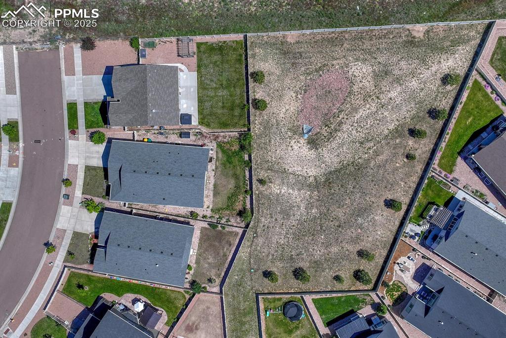 8437 Salt Brush Road Colorado Springs, CO 80908 - Photo 42 of 45 Elevate your perspective with this captivating aerial view, highlighting the property's prime location within a desirable suburban area, full of promise and potential.
