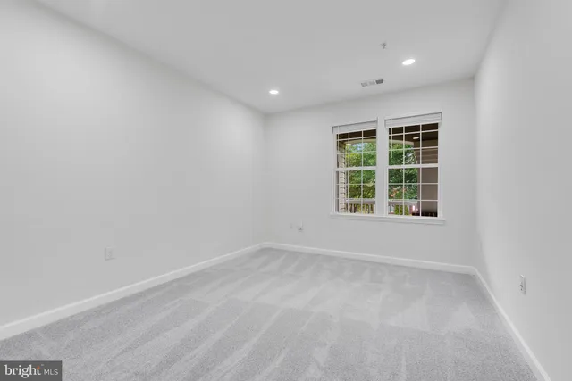 a bathroom with a granite countertop sink a toilet and bathtub