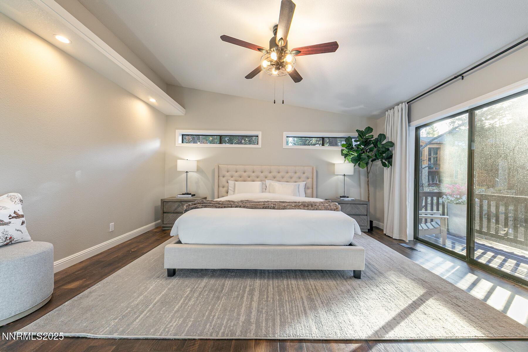25 Winterberry Court Reno, NV 89511 - Photo 20 of 31 a bedroom with a large bed and a chandelier fan
