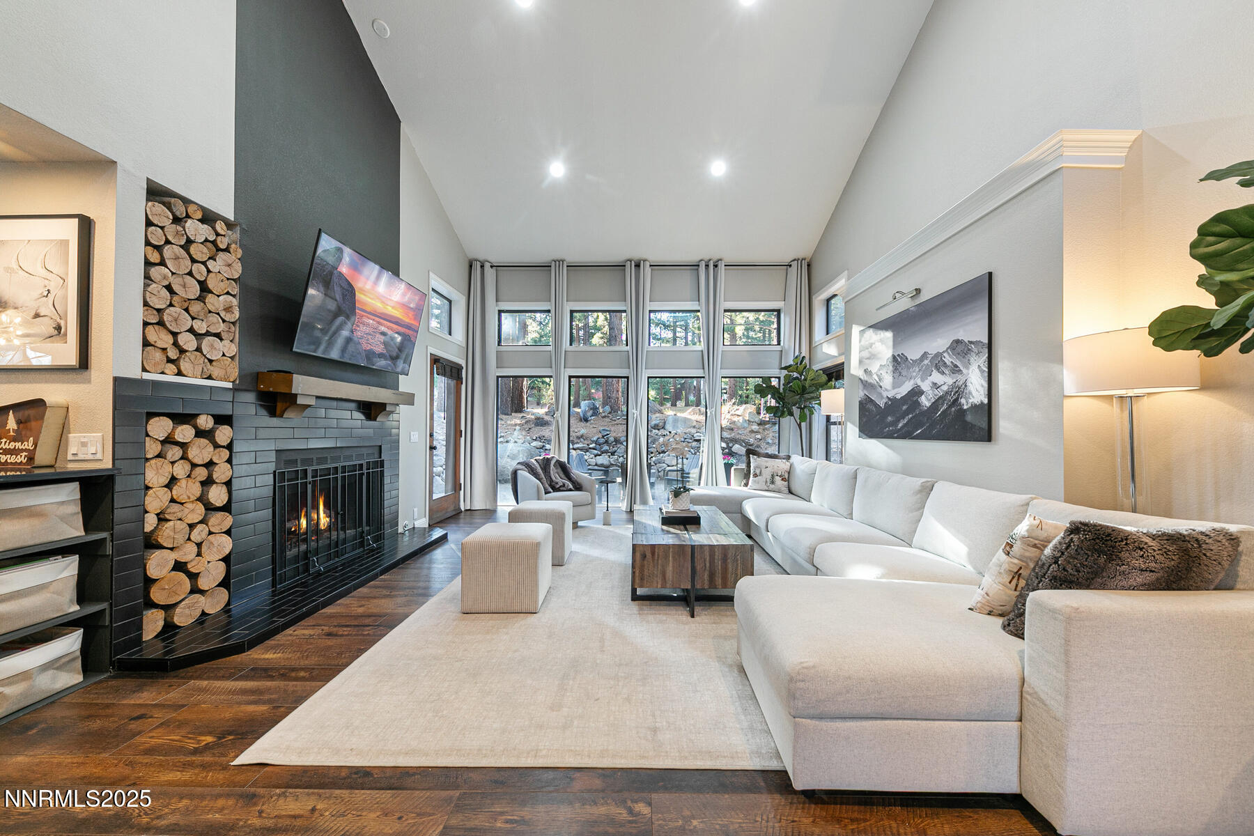 25 Winterberry Court Reno, NV 89511 - Photo 3 of 31 a living room with furniture a flat screen tv and a fireplace