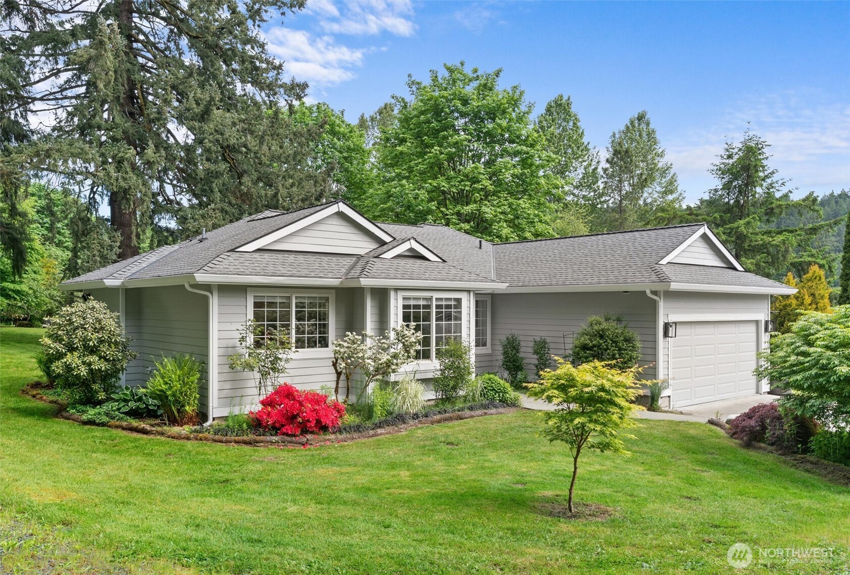 16100 Southeast 113th Place Renton, WA 98059 - Photo 1 of 40 a front view of house with yard and green space