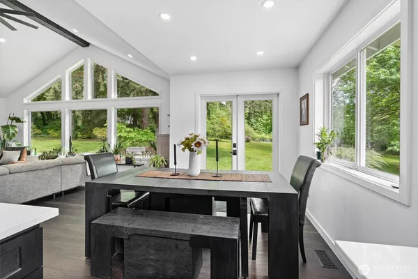 a dining room with furniture and window
