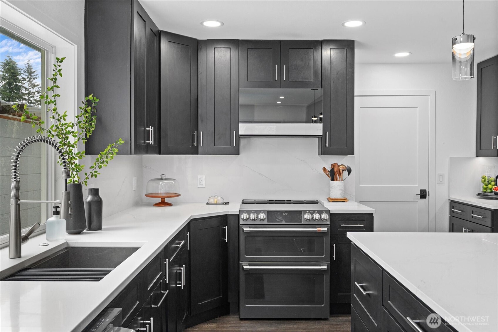 16100 Southeast 113th Place Renton, WA 98059 - Photo 14 of 40 a kitchen with a sink stove and refrigerator