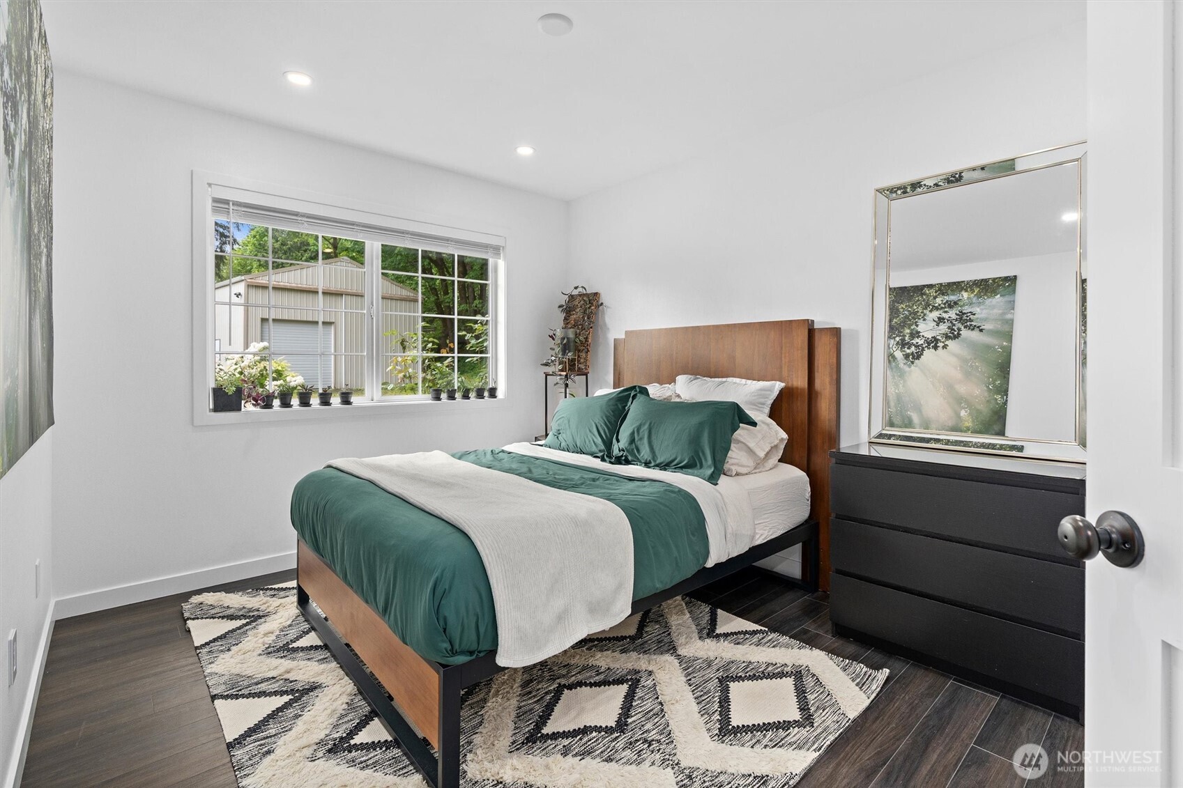 16100 Southeast 113th Place Renton, WA 98059 - Photo 25 of 40 a bedroom with a bed lamp and a window