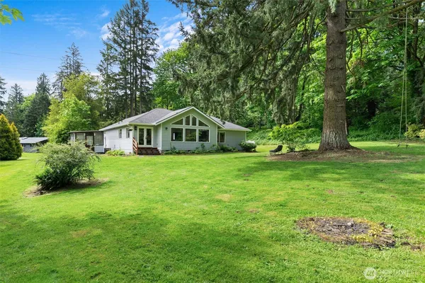 a view of a backyard with a garden