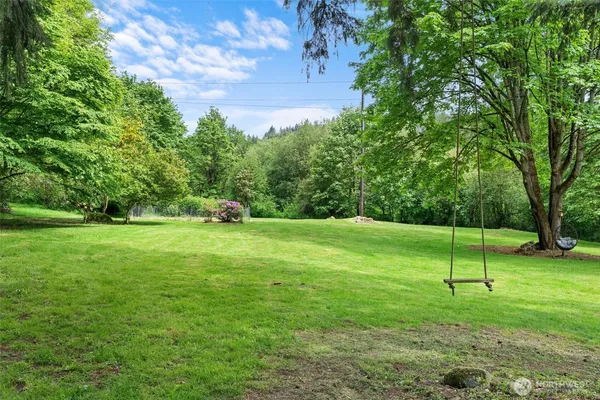 a view of outdoor space with deck and yard