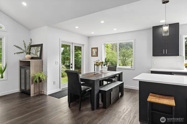 a view of a dining room with furniture window and wooden floor