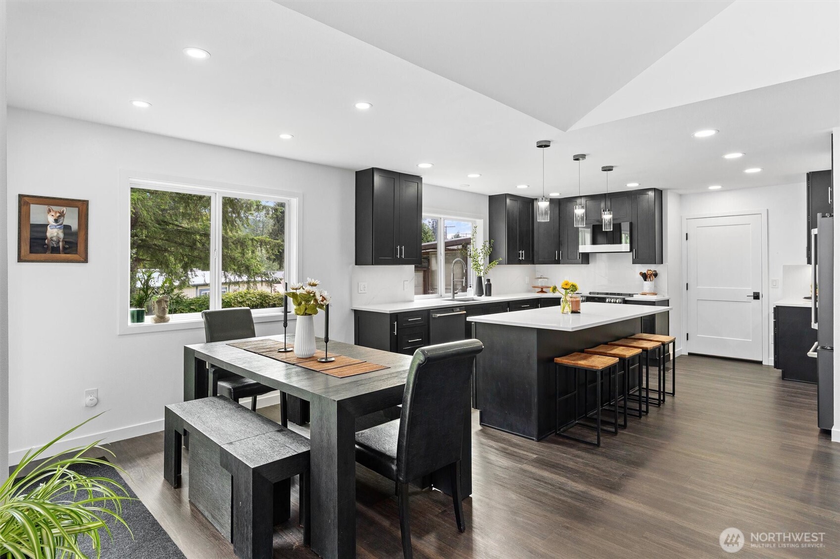 16100 Southeast 113th Place Renton, WA 98059 - Photo 10 of 40 a room with stainless steel appliances kitchen island granite countertop a dining table chairs and view living room