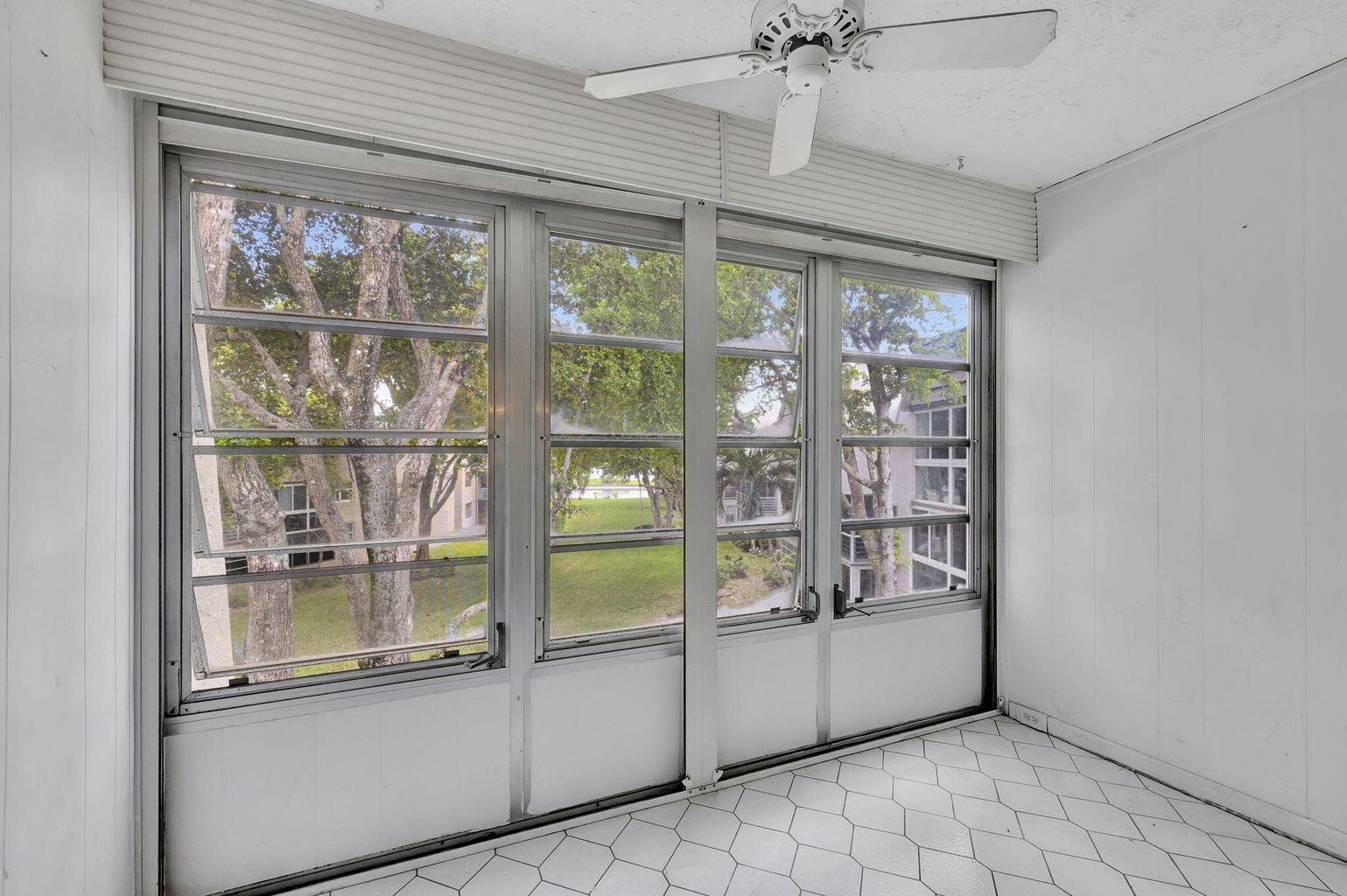 9300 Lime Bay Boulevard, Unit 302 Tamarac, FL 33321 - Photo 13 of 15 a view of an empty room with a window