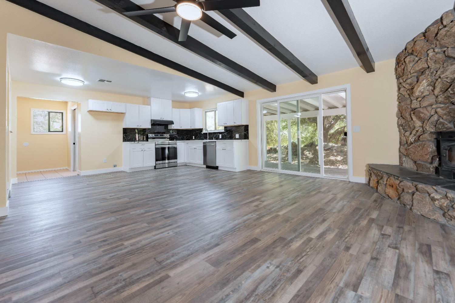 47517 Road 200 O'Neals, CA 93645 - Photo 19 of 54 a view of a kitchen with furniture and wooden floor