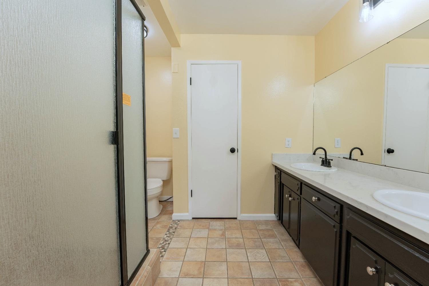 47517 Road 200 O'Neals, CA 93645 - Photo 24 of 54 a view of a bathroom with sink mirror and bathtub