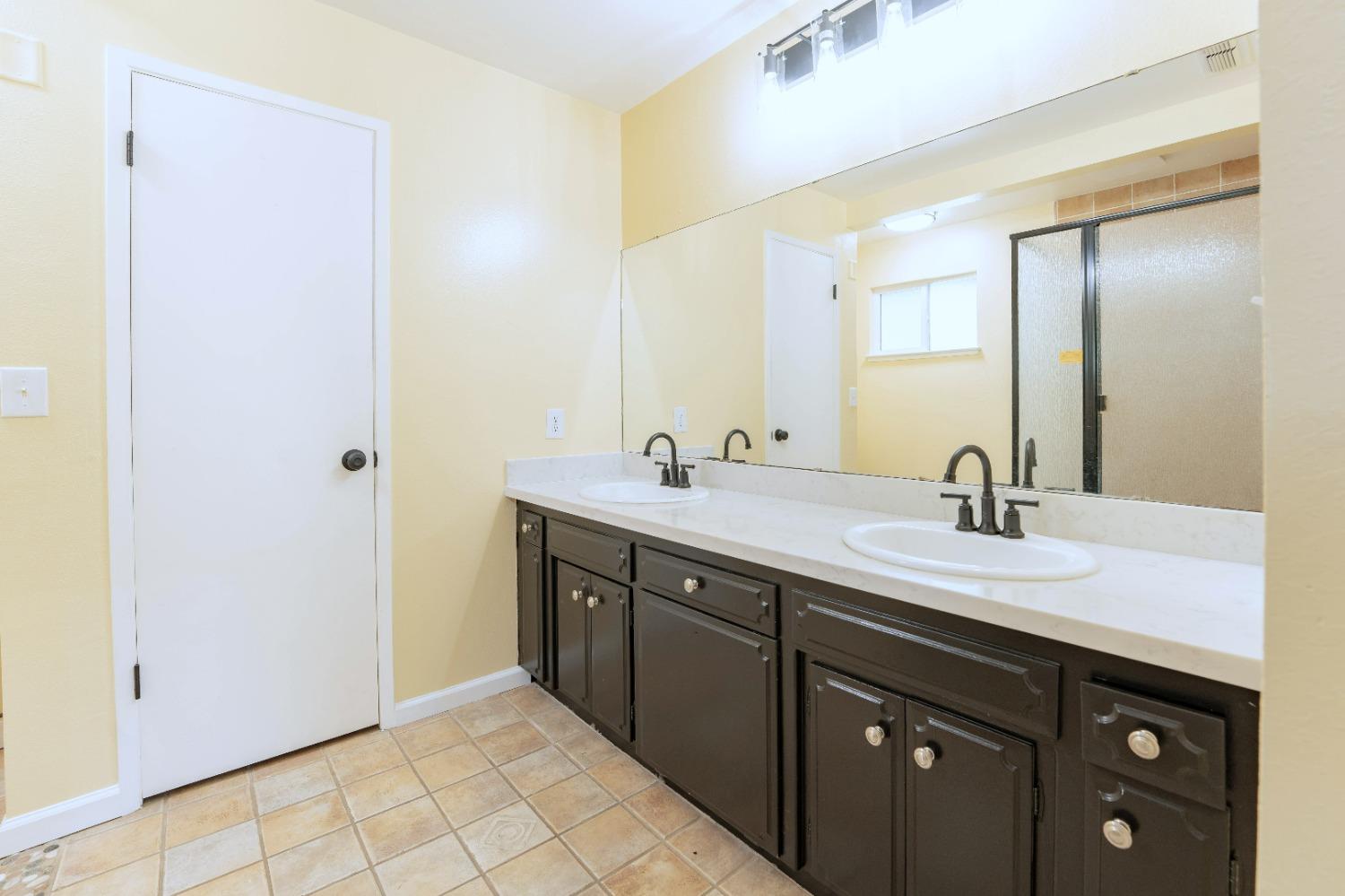 47517 Road 200 O'Neals, CA 93645 - Photo 25 of 54 a bathroom with a double vanity sink and a mirror