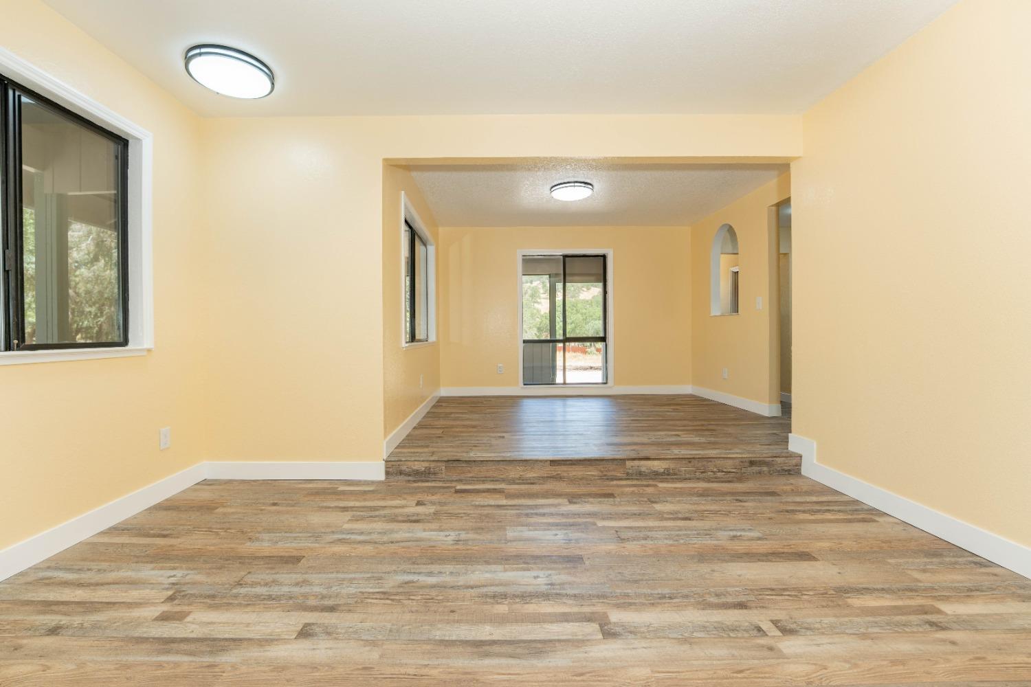 47517 Road 200 O'Neals, CA 93645 - Photo 7 of 54 a view of an empty room with wooden floor and a window