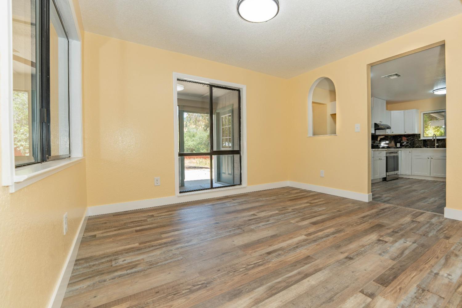 47517 Road 200 O'Neals, CA 93645 - Photo 8 of 54 a view of empty room with wooden floor and fan