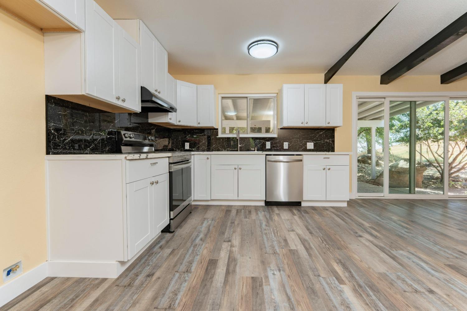 47517 Road 200 O'Neals, CA 93645 - Photo 10 of 54 a kitchen with a sink wooden floor and stainless steel appliances