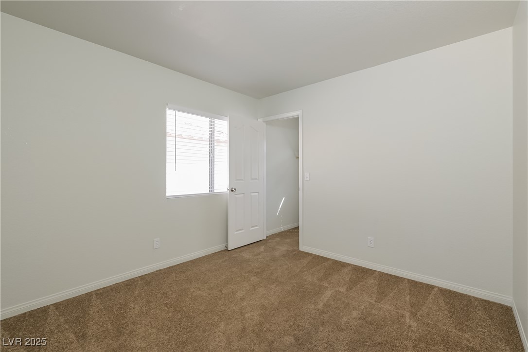 8906 Chapman Point Las Vegas, NV 89129 - Photo 11 of 13 Carpeted spare room with baseboards