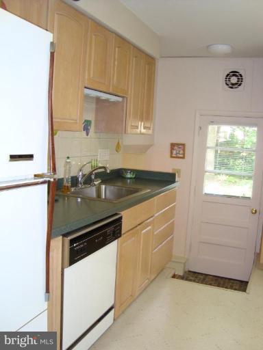 221 Rickswood Road Lutherville-Timonium, MD 21093 - Photo 9 of 30 Remodeled kitchen - cabinets, counter top, sink.