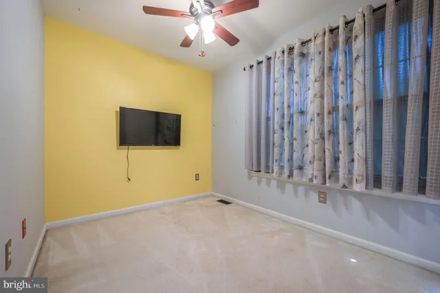 a view of a livingroom with a flat screen tv