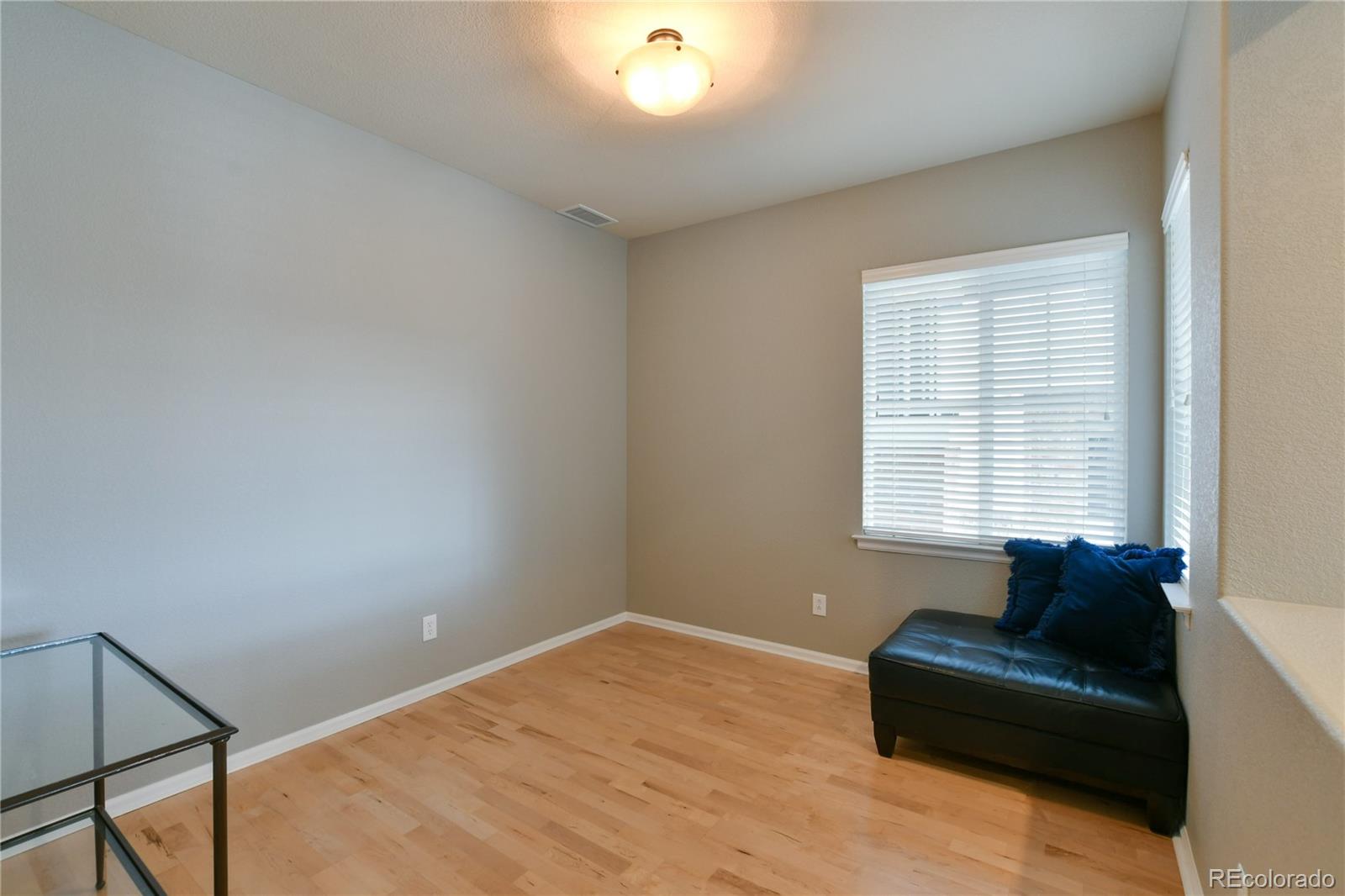 156 Whitehaven Circle Highlands Ranch, CO 80129 - Photo 14 of 30 a living room with furniture and a window