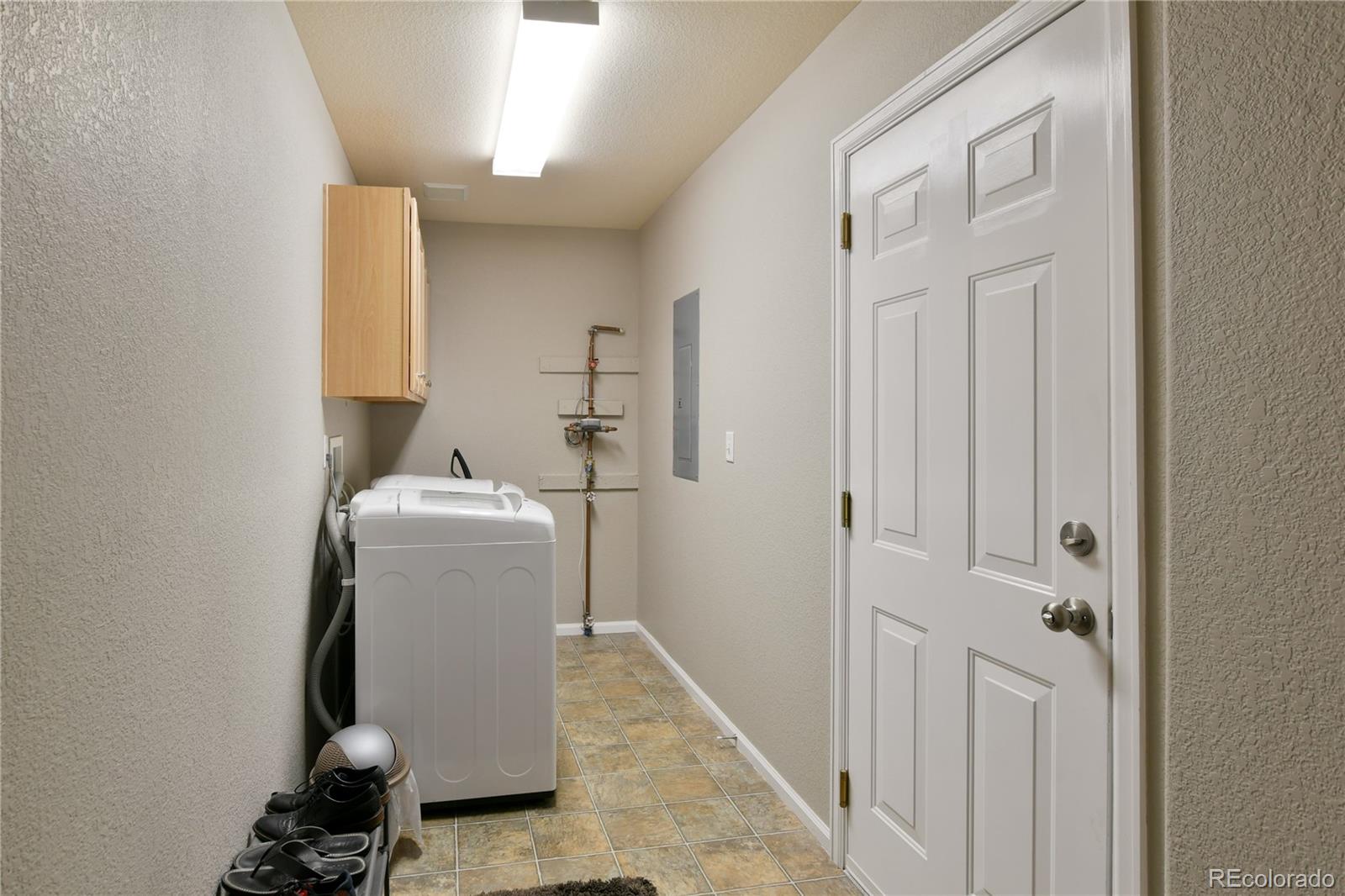 156 Whitehaven Circle Highlands Ranch, CO 80129 - Photo 15 of 30 a room with a washer and dryer