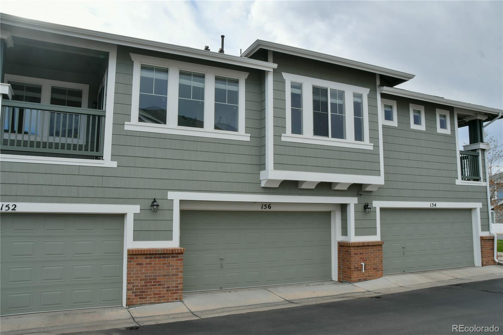 156 Whitehaven Circle Highlands Ranch, CO 80129 - Photo 29 of 30 a front view of a house with many windows