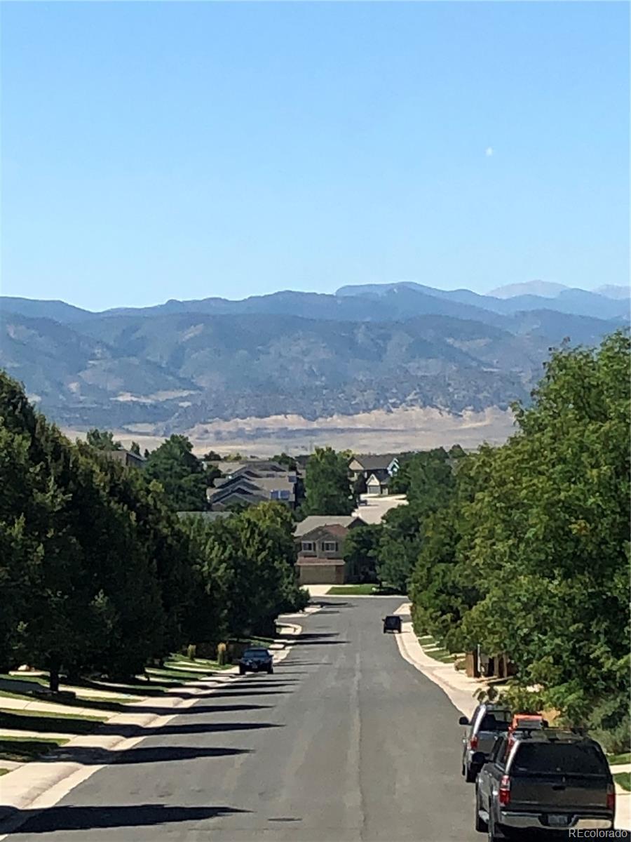 156 Whitehaven Circle Highlands Ranch, CO 80129 - Photo 30 of 30 a view of street with a car parked on the road