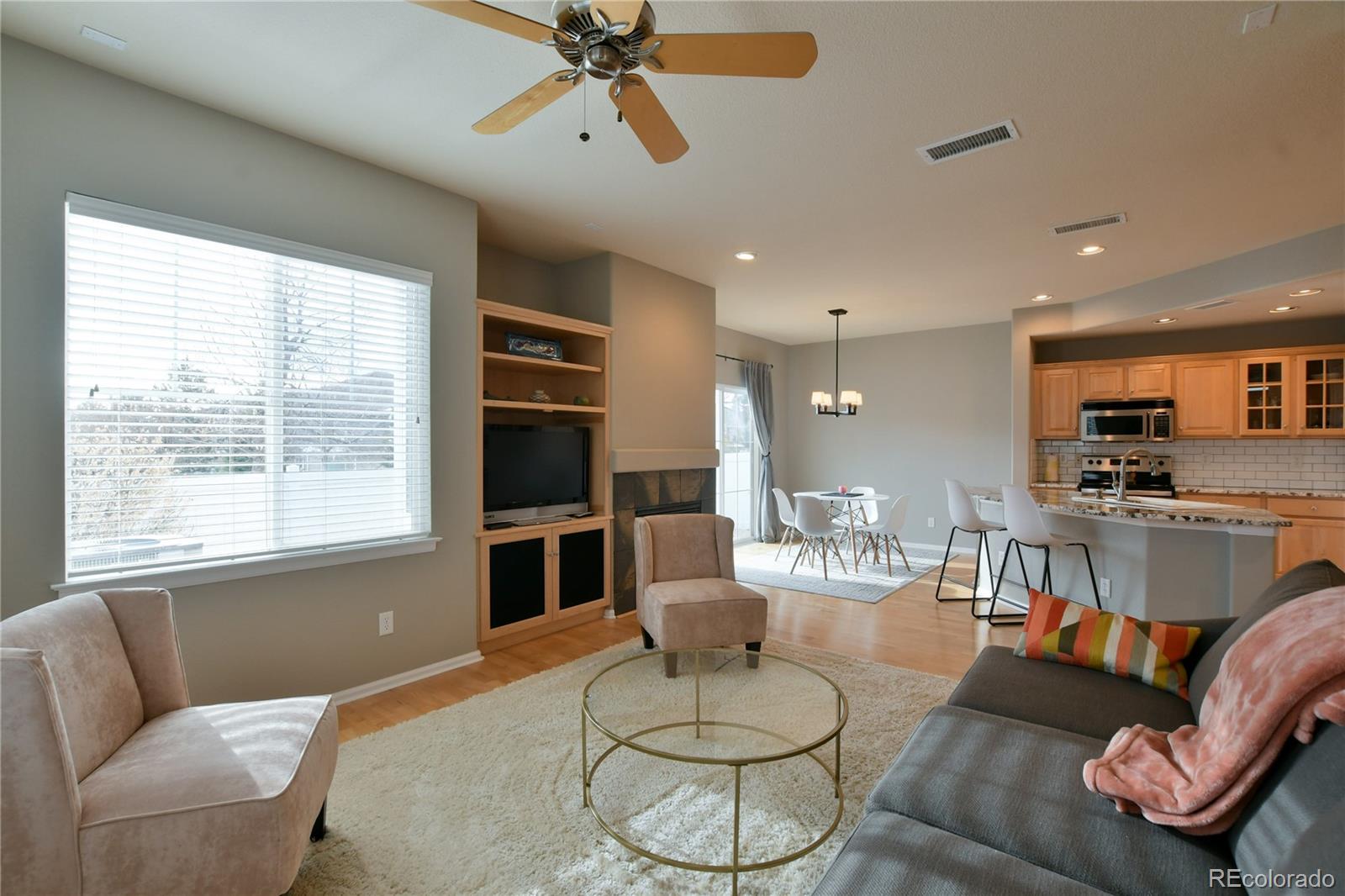 156 Whitehaven Circle Highlands Ranch, CO 80129 - Photo 3 of 30 a living room with furniture and a large window
