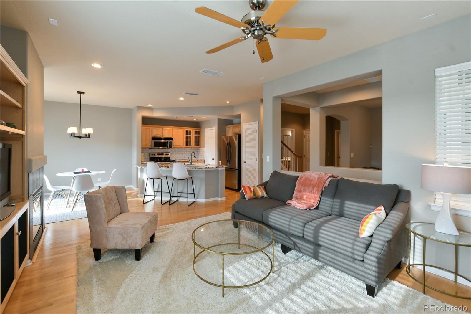 156 Whitehaven Circle Highlands Ranch, CO 80129 - Photo 4 of 30 a living room with furniture and a flat screen tv