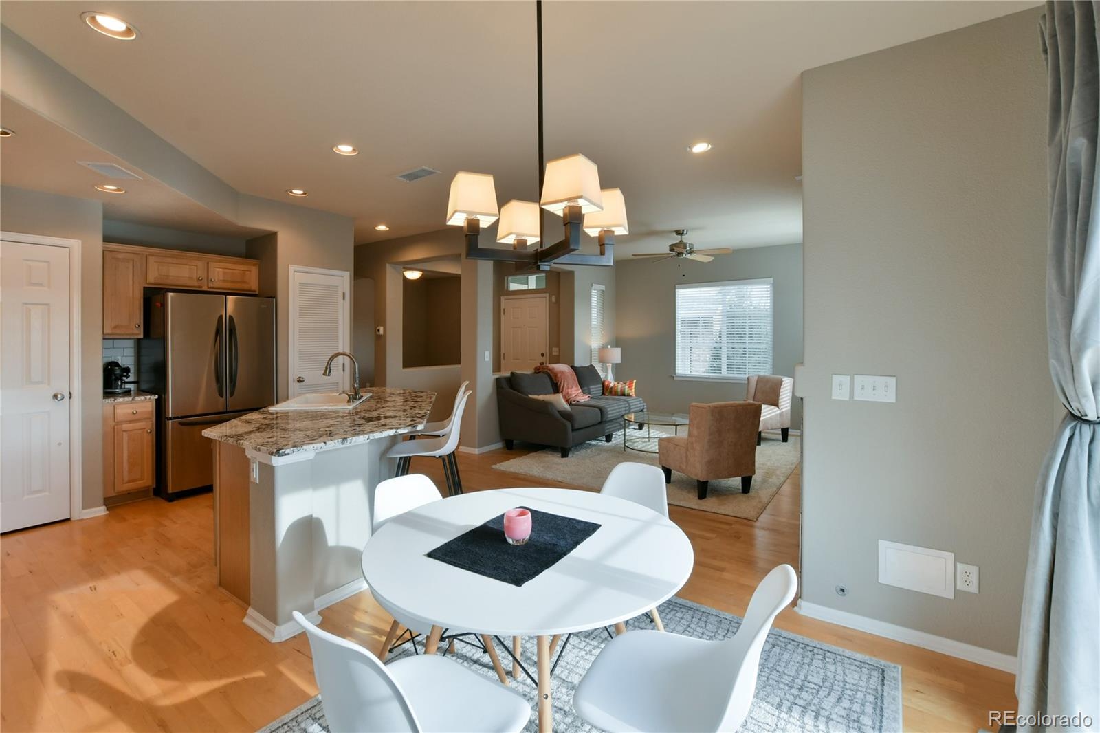 156 Whitehaven Circle Highlands Ranch, CO 80129 - Photo 8 of 30 a very nice looking dining room with a table and chairs