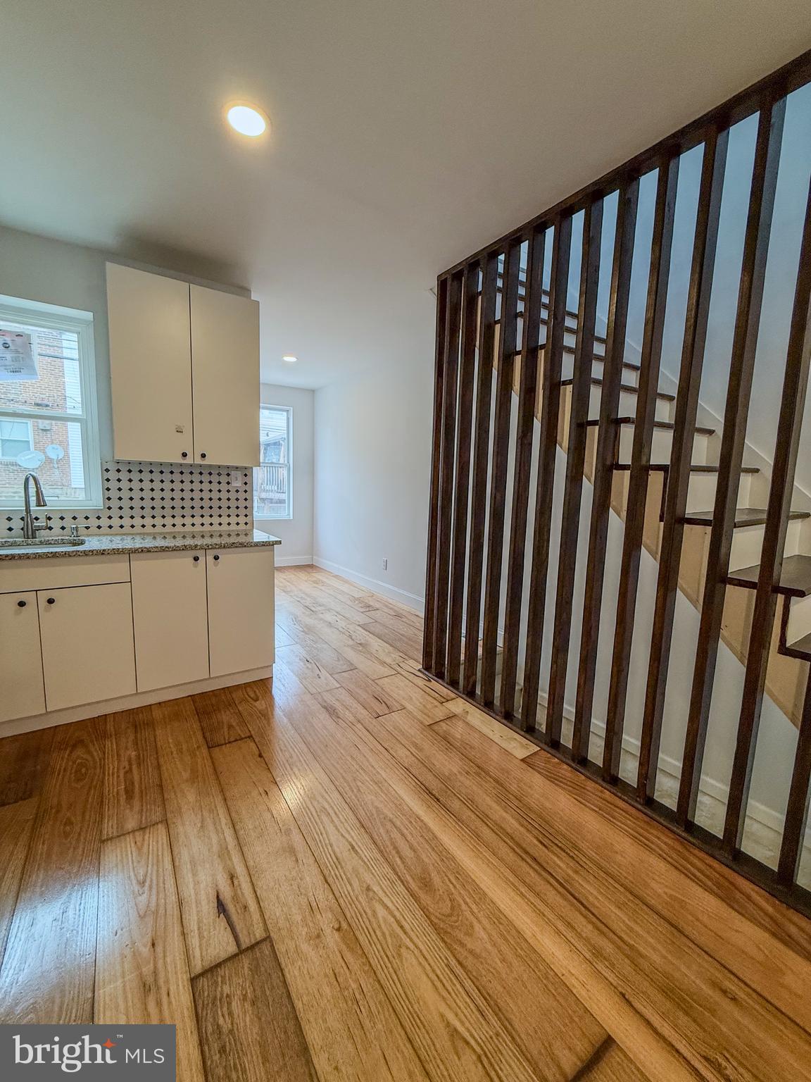 2079 Anchor Street Philadelphia, PA 19124 - Photo 11 of 26 a view of a hallway with wooden floor and a fireplace