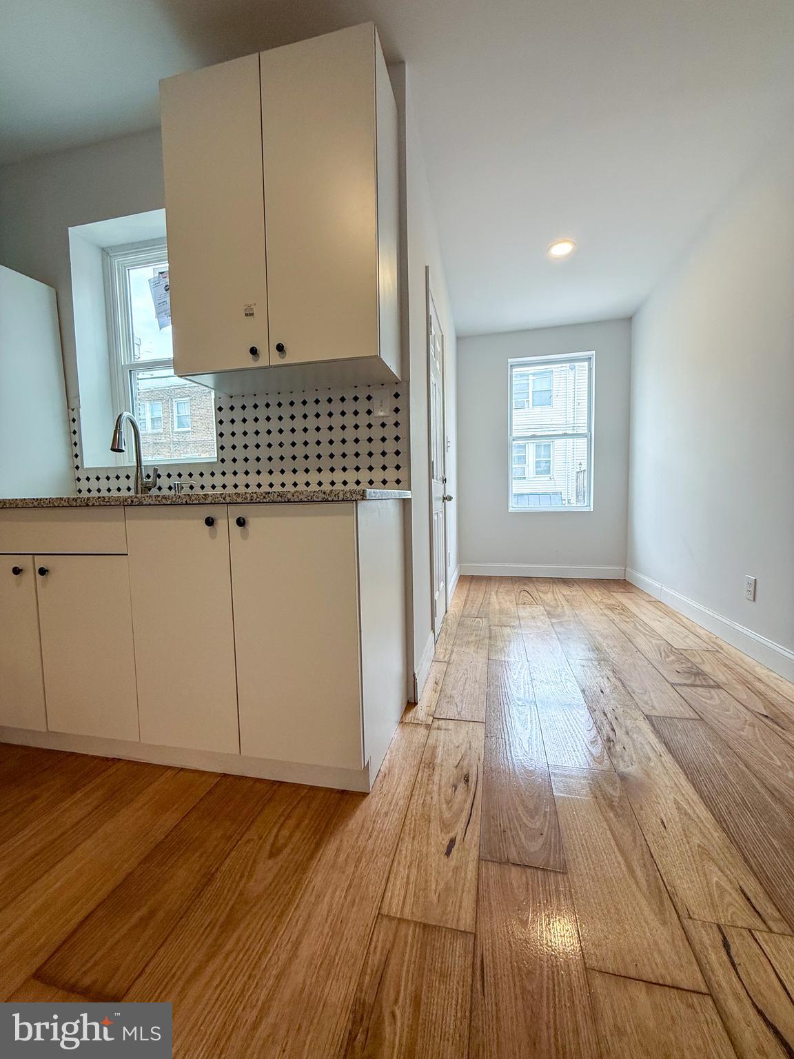 2079 Anchor Street Philadelphia, PA 19124 - Photo 12 of 26 a view of a kitchen with wooden floor and a sink