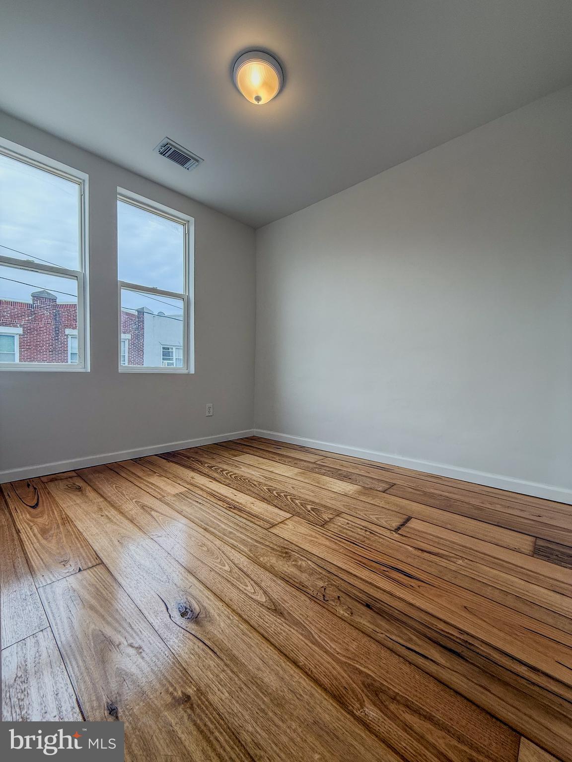 2079 Anchor Street Philadelphia, PA 19124 - Photo 18 of 26 a view of empty room with wooden floor and fan