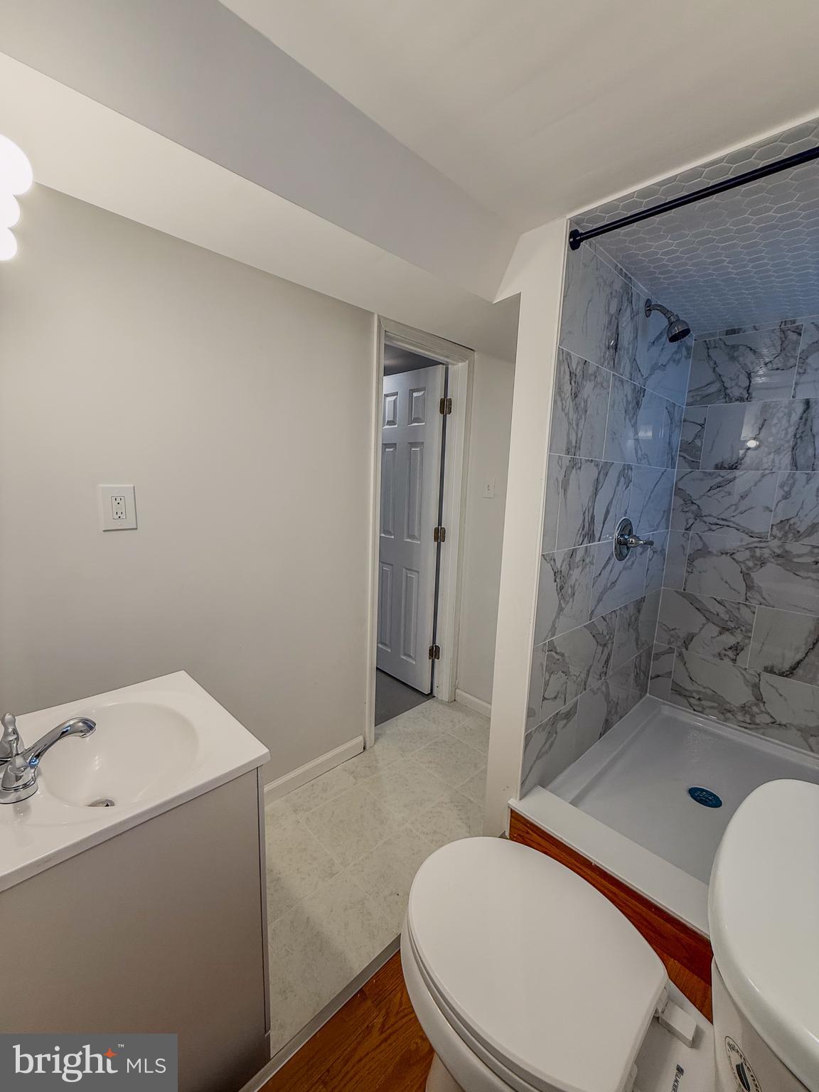 2079 Anchor Street Philadelphia, PA 19124 - Photo 24 of 26 a bathroom with a sink a toilet and shower