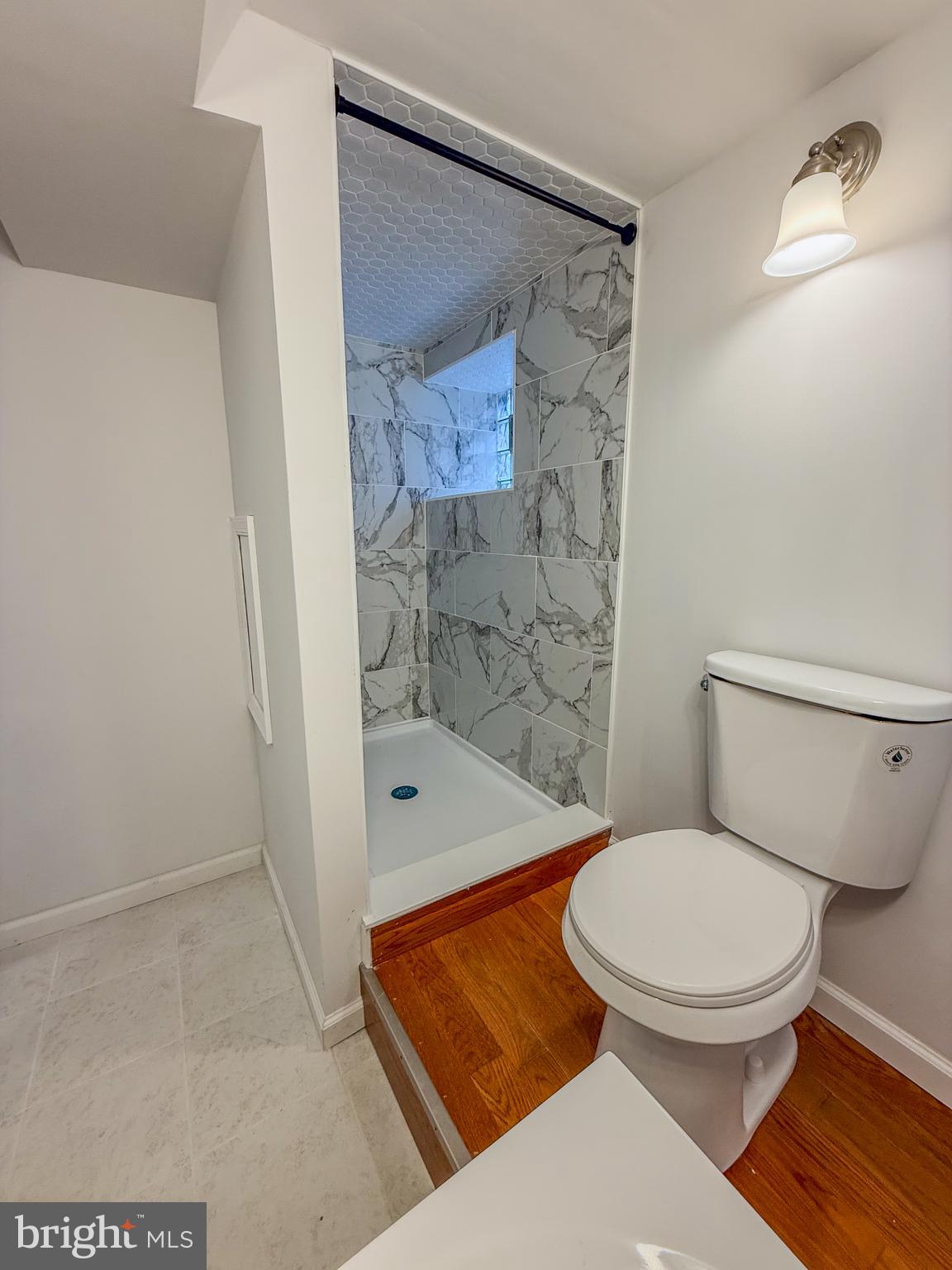 2079 Anchor Street Philadelphia, PA 19124 - Photo 25 of 26 a bathroom with a toilet and a shower