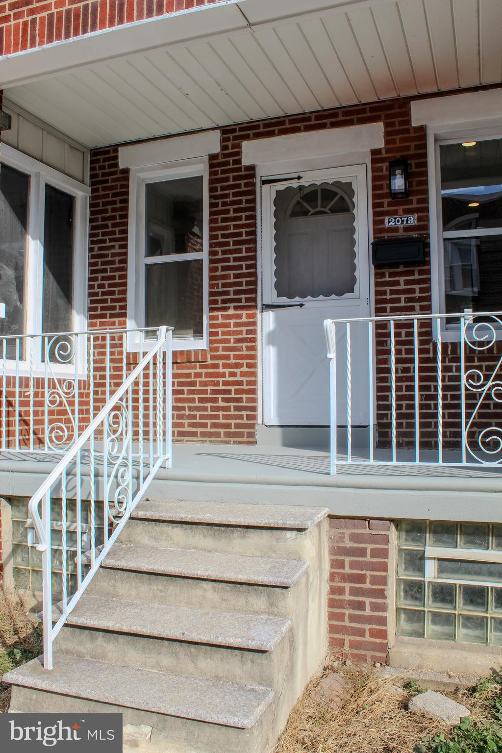2079 Anchor Street Philadelphia, PA 19124 - Photo 3 of 26 a view of a brick house with large windows