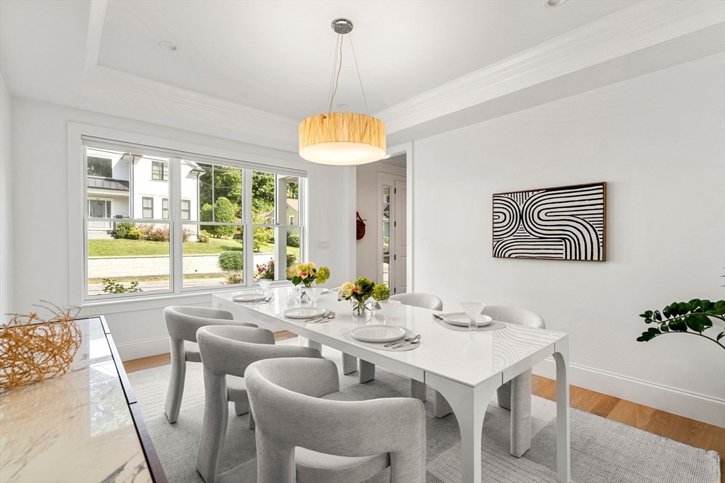 39 Donna Road Needham, MA 02494 - Photo 16 of 42 a dining room with furniture a window and a chandelier