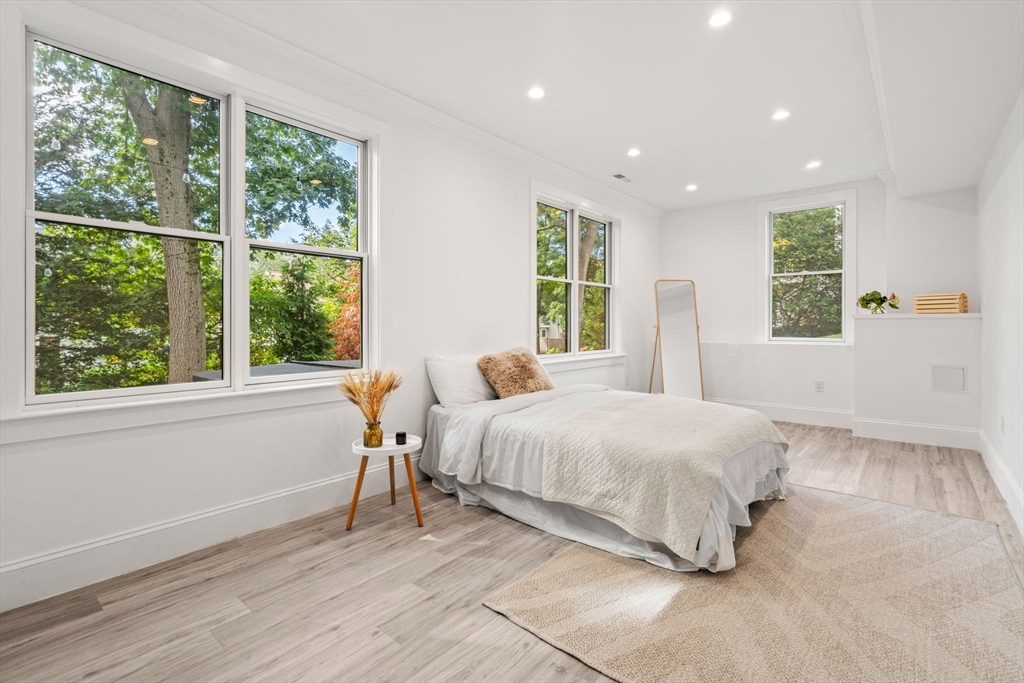 39 Donna Road Needham, MA 02494 - Photo 37 of 42 a bedroom with a large bed and a large window