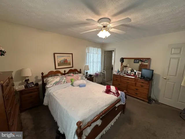 a bed room with a bed and a chandelier