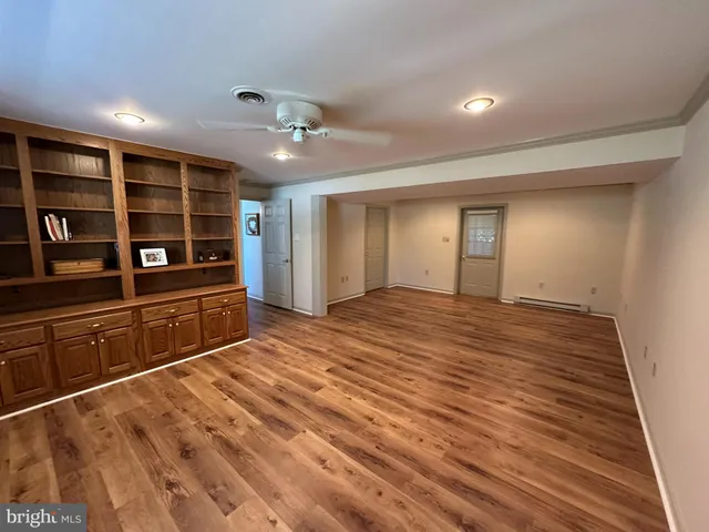 a view of a livingroom with furniture and closet