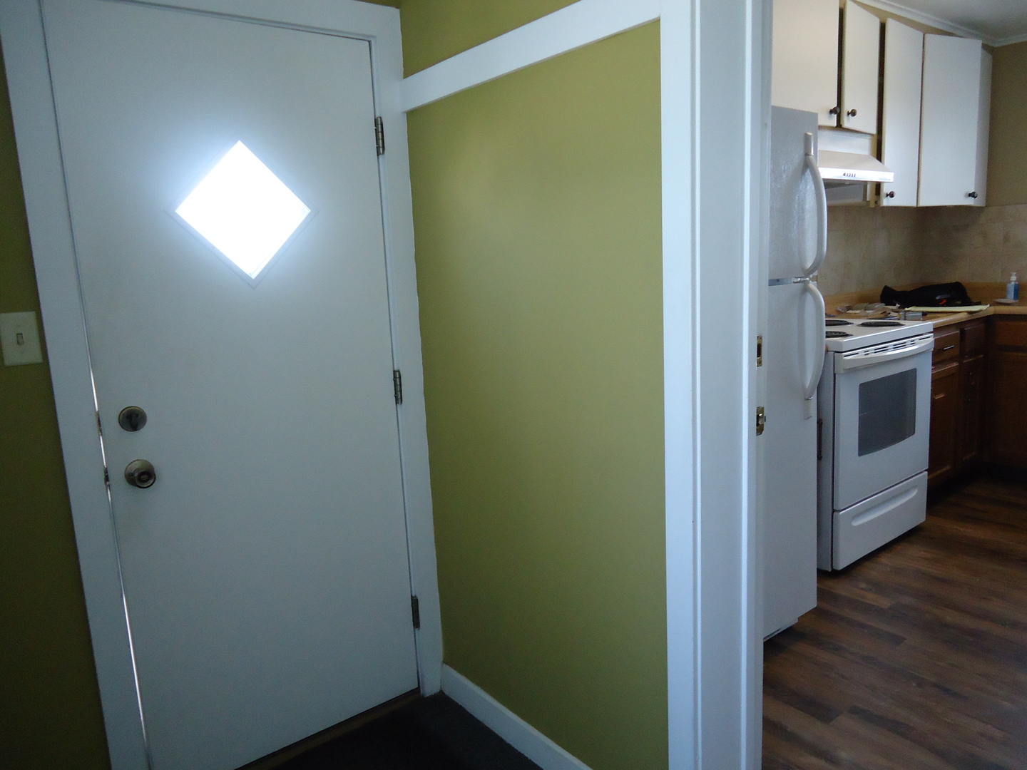 792 North 15th Road Lostant, IL 61334 - Photo 3 of 31 a kitchen with a refrigerator and wooden floor
