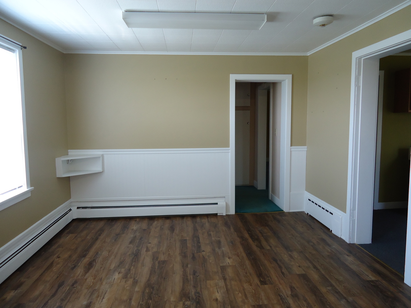 792 North 15th Road Lostant, IL 61334 - Photo 6 of 31 an empty room with wooden floor and windows