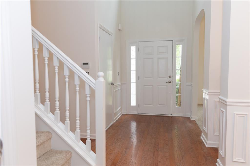 502 Streamside Place Canton, GA 30115 - Photo 2 of 33 a view of entryway with wooden floor