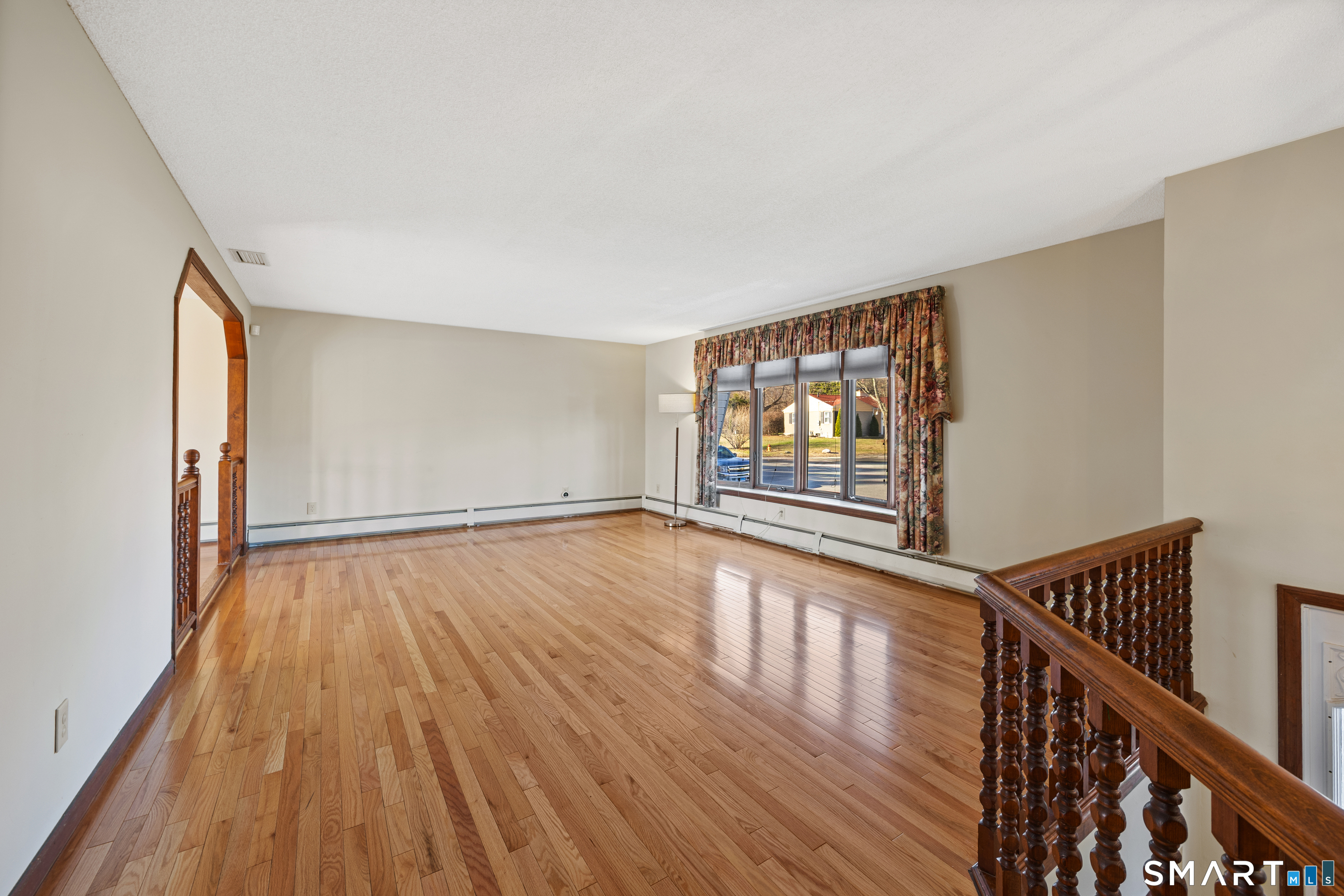 622 Lakeside Boulevard West Waterbury, CT 06708 - Photo 11 of 40 a view of an empty room with wooden floor and a window