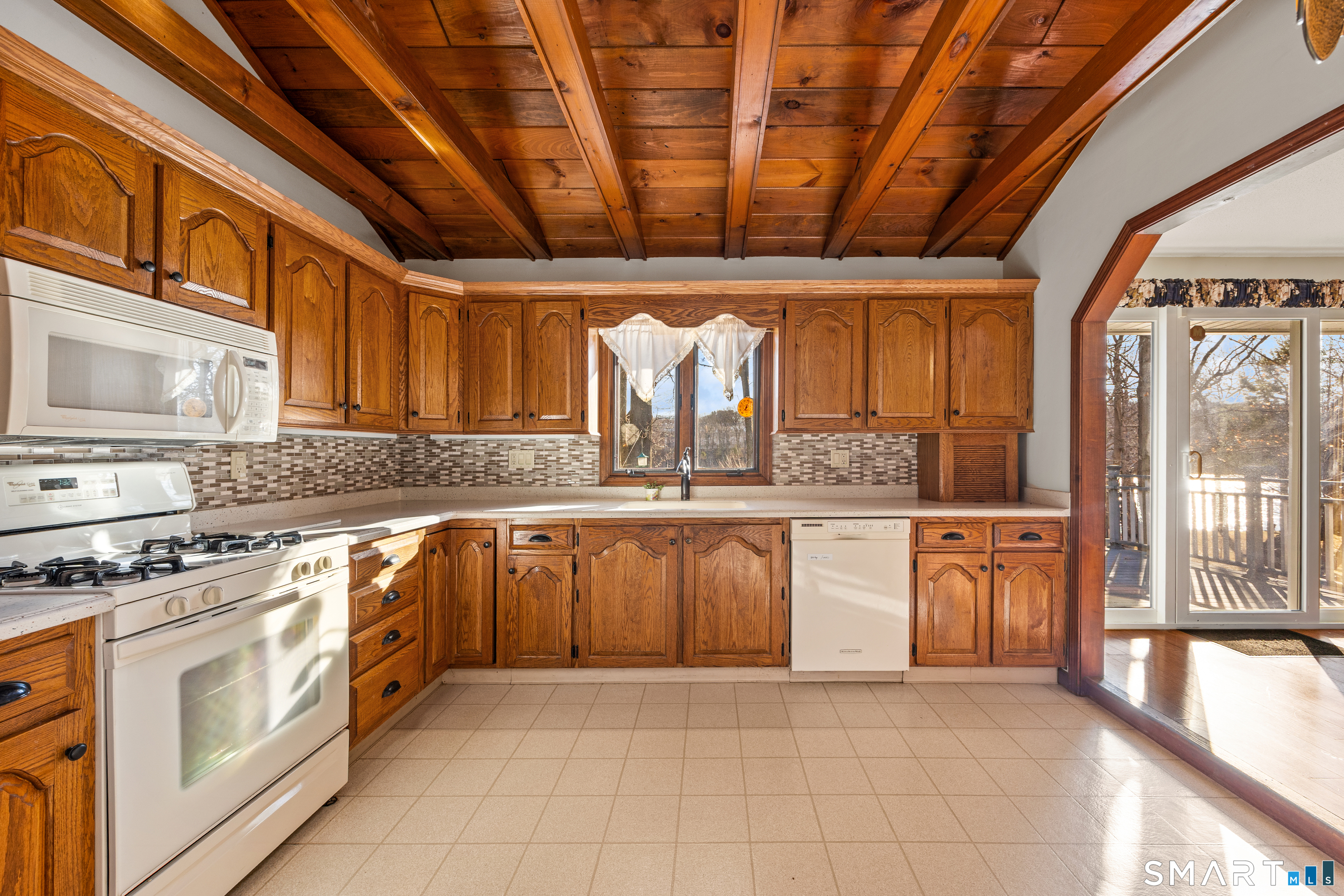 622 Lakeside Boulevard West Waterbury, CT 06708 - Photo 12 of 40 a large kitchen with stainless steel appliances granite countertop a stove a sink dishwasher and cabinets with wooden floor