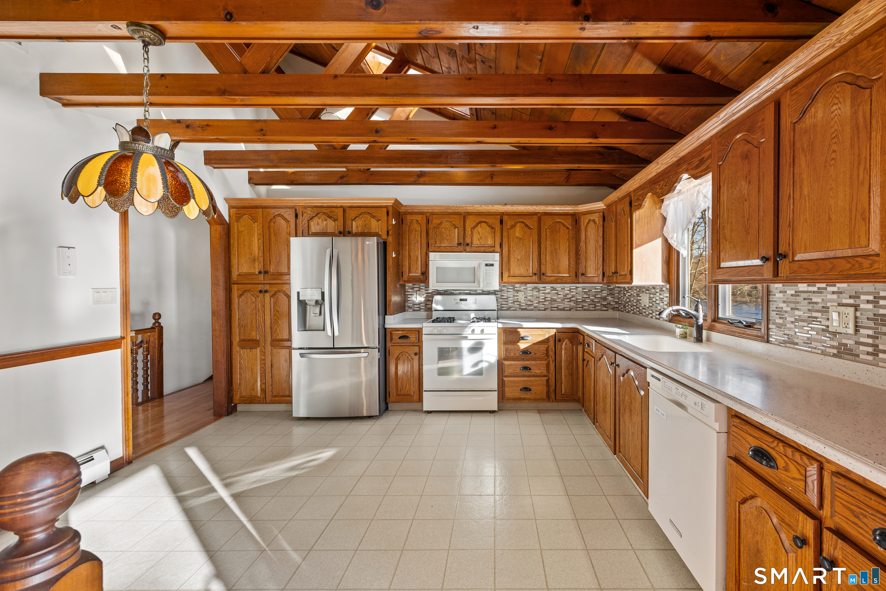 622 Lakeside Boulevard West Waterbury, CT 06708 - Photo 13 of 40 a kitchen with stainless steel appliances a refrigerator and a sink