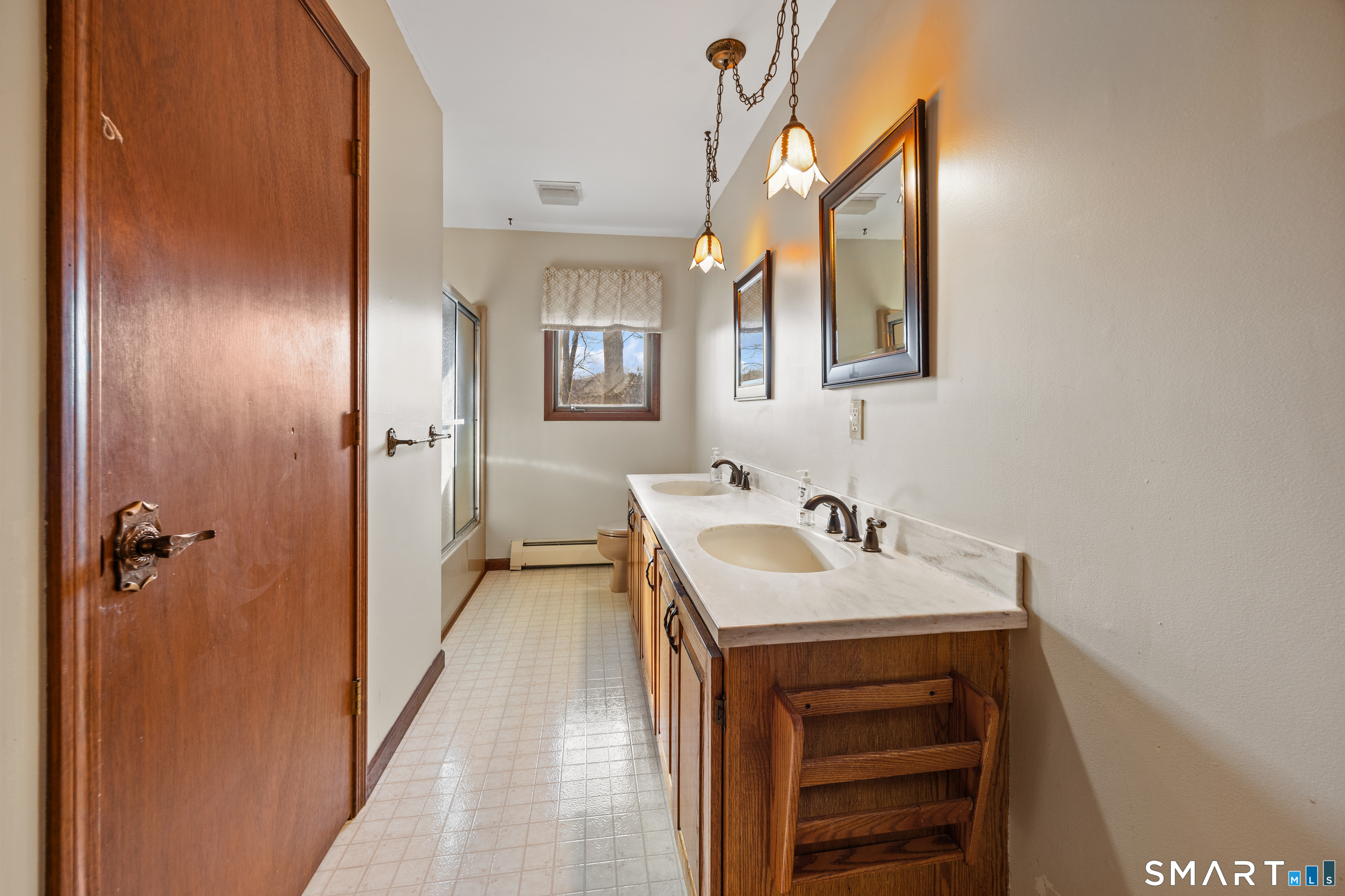 622 Lakeside Boulevard West Waterbury, CT 06708 - Photo 17 of 40 a bathroom with a sink and a mirror