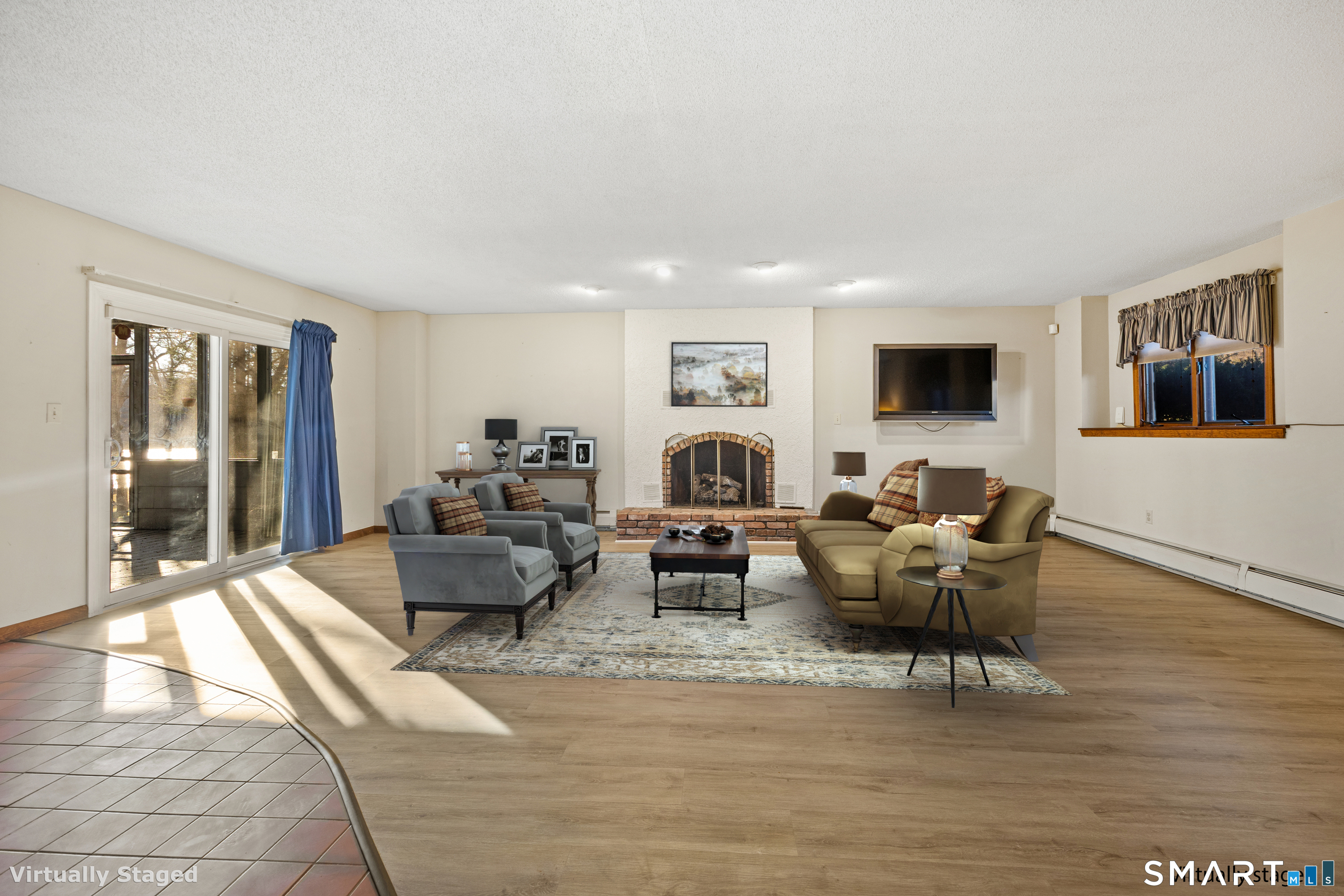 622 Lakeside Boulevard West Waterbury, CT 06708 - Photo 24 of 40 a living room with furniture wooden floor and a flat screen tv