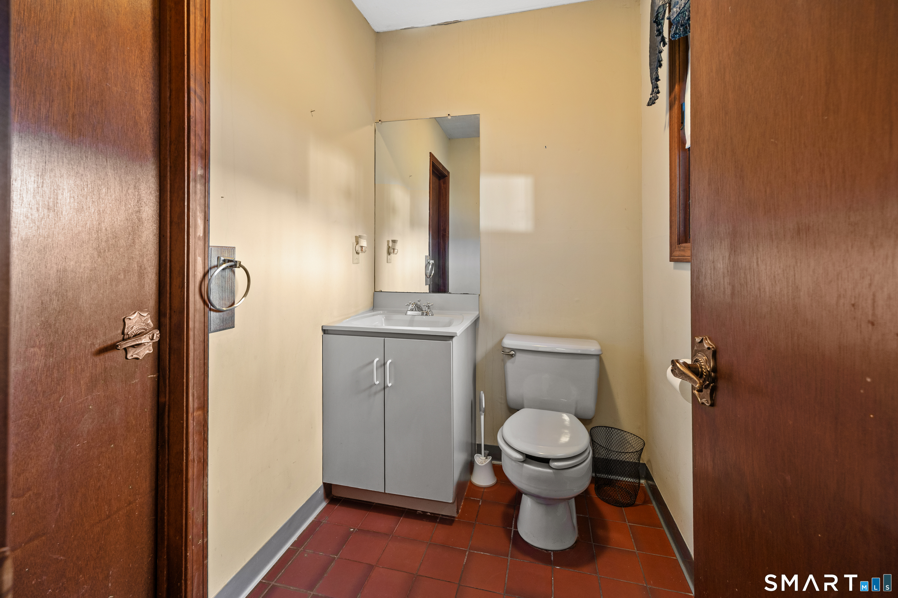 622 Lakeside Boulevard West Waterbury, CT 06708 - Photo 28 of 40 a bathroom with a toilet and a mirror