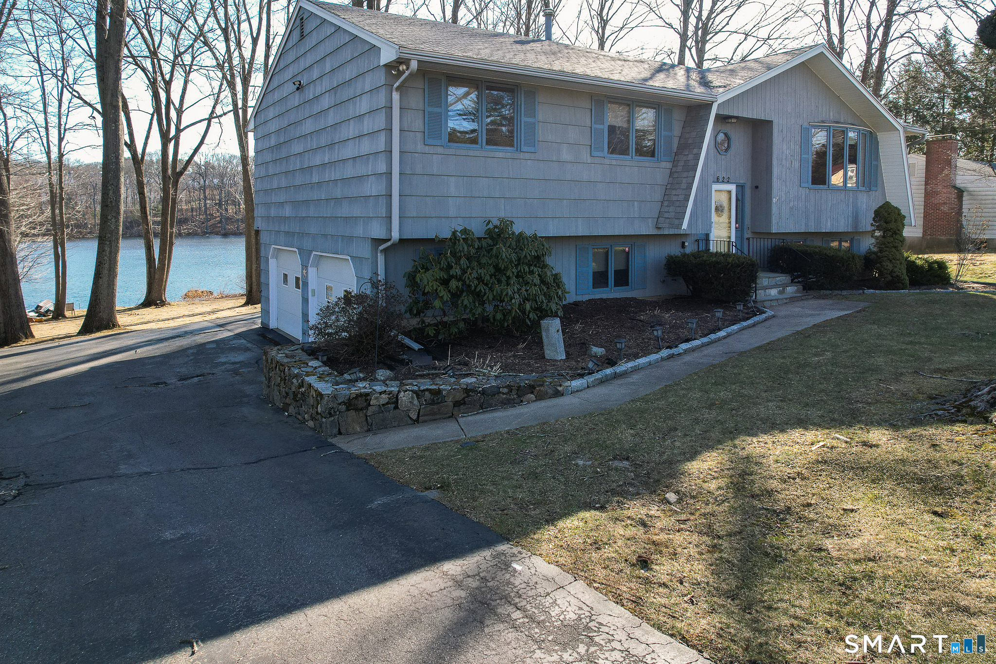 622 Lakeside Boulevard West Waterbury, CT 06708 - Photo 3 of 40 a front view of a house with garden